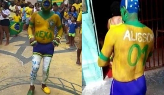 Imagem de Com o corpo todo pintado de verde e amarelo, baiano espera hexa da Seleção