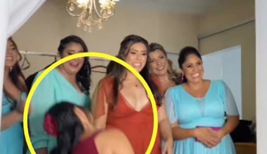 Imagem de Mãe desmaia após ver filha vestida de noiva e vídeo viraliza; "não segurei a emoção' 